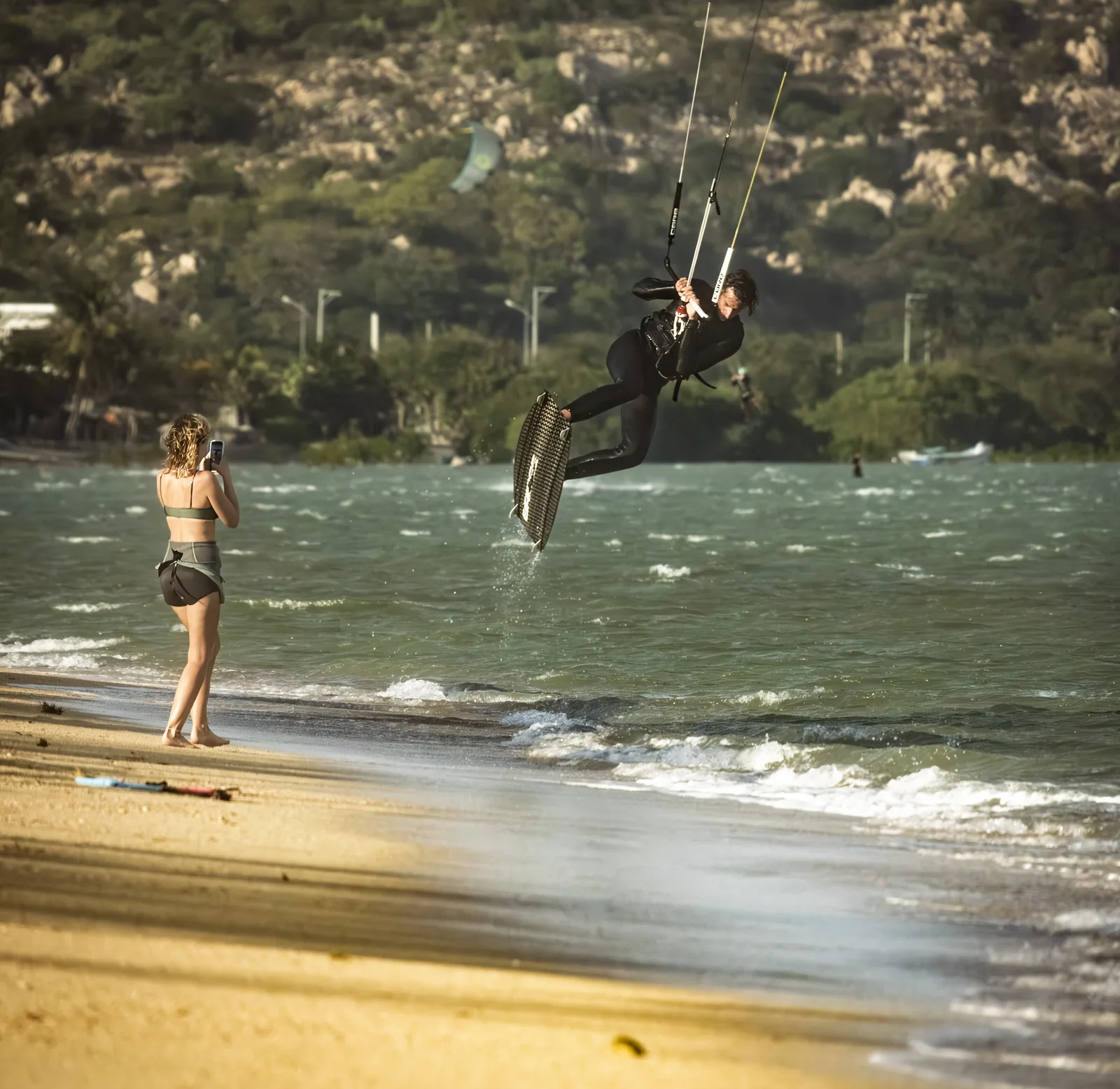 Wojciech Stopa jumping near the beach in Vietnam